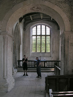 the chancel seen from the nave - note the friendly keyholder and the angus dei on the underside of the western crossing arch.